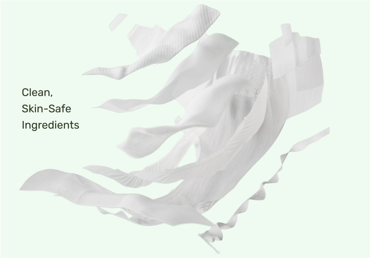 Separated white diaper layers floating apart with the text “Clean, Skin-Safe Ingredients”