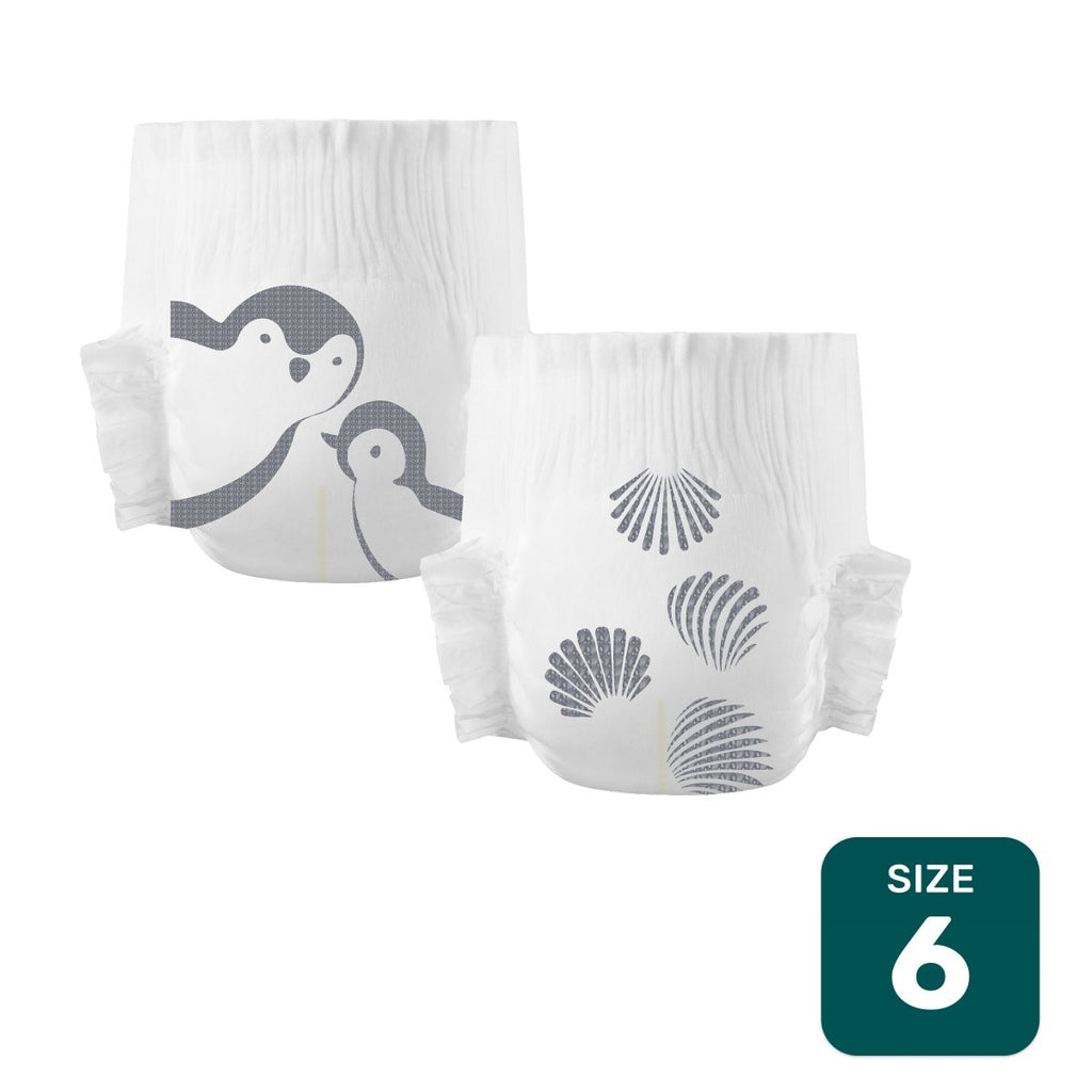 Two white Parasol Size 6 diapers, one with gray penguins and one with gray seashells